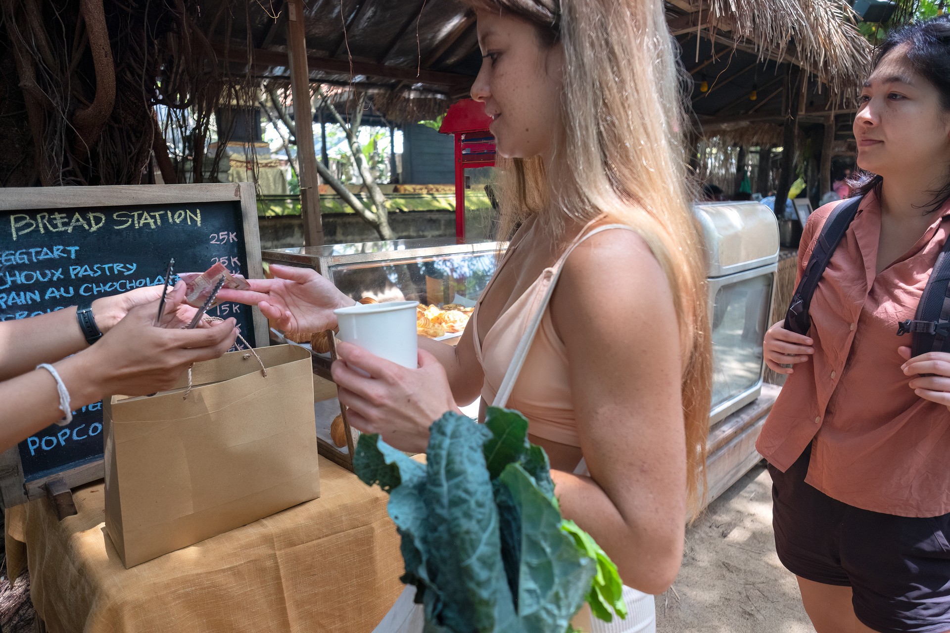 Eurasian Professional Nutritionist Shopping for Healthy Bread, Vegetables with Client